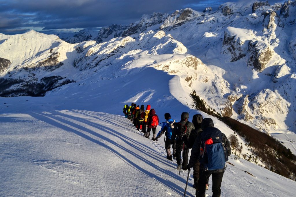 Hikers at Berizhdoli Peak in Lepusha